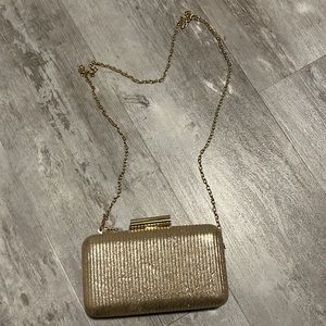 Gold clutch and crossbody bag